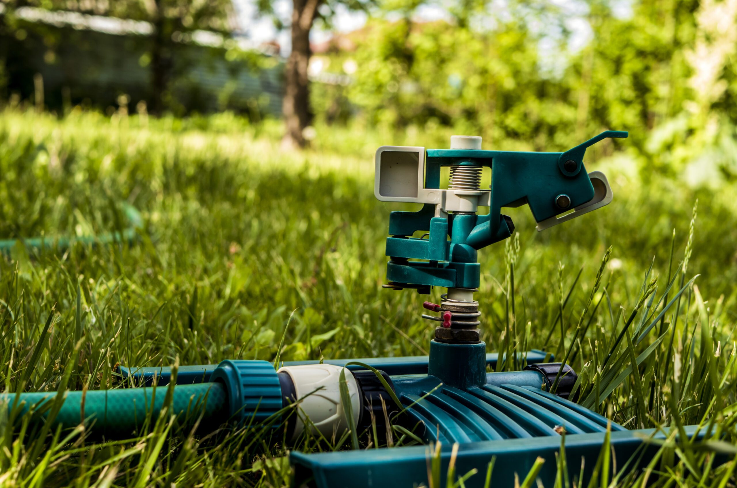 turned off garden watering sprinkers on the grass